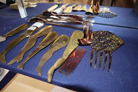 Seven brass stocking leg shoe horns and a group of tortoiseshell hair combs, spoon, page turner, etc.